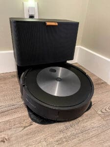 A Roomba j7 with self-emptying bin is great for hard surfaced floors and sucking up dog hair.